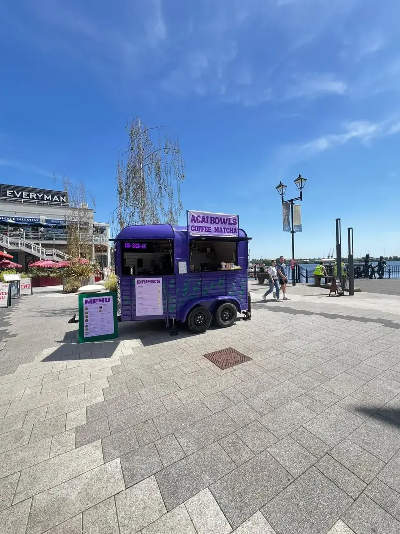 The purple horsebox beside the water at Mermaid Quay